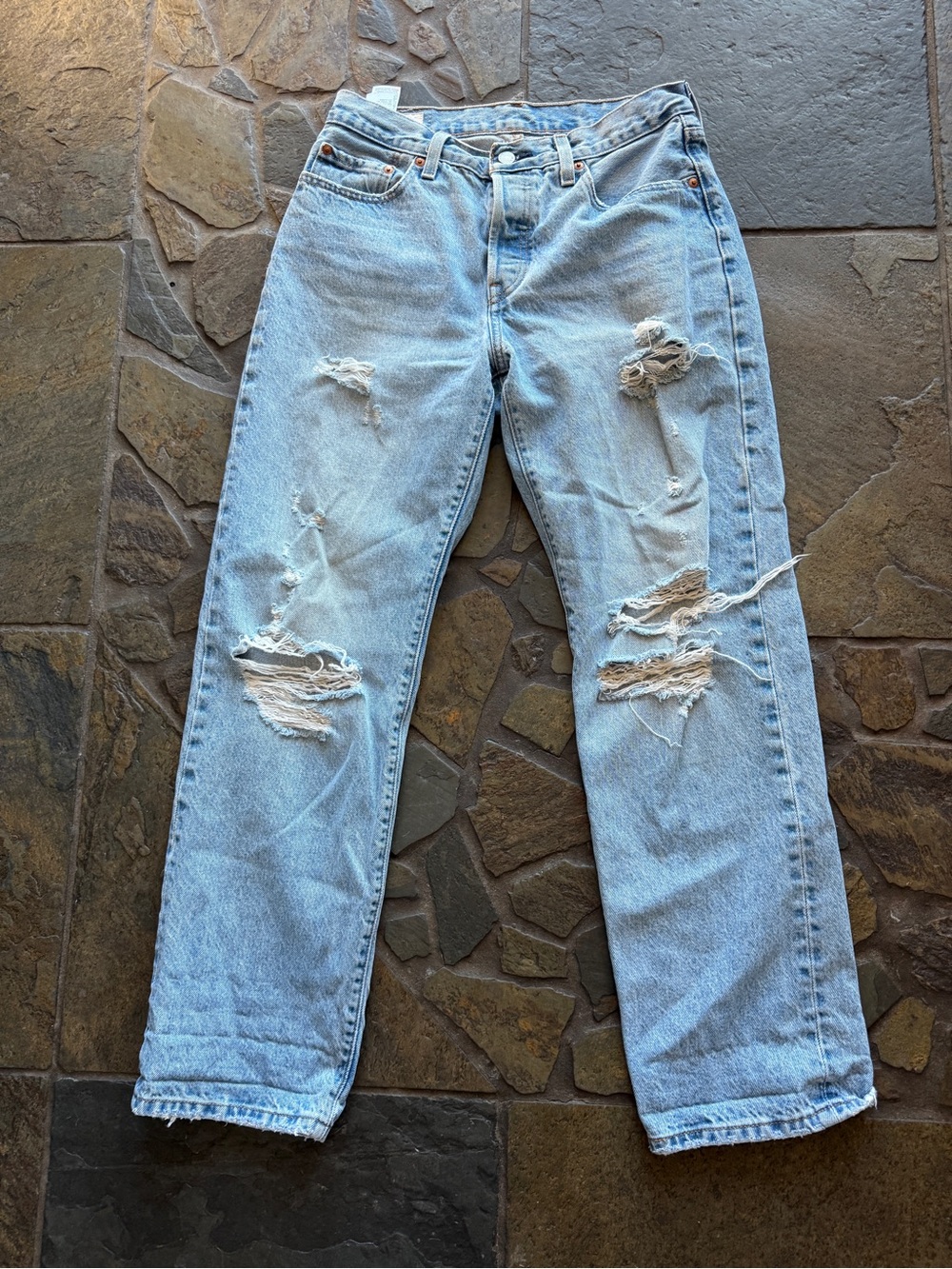 Levi’s 501 distressed jeans size 27 x 30.